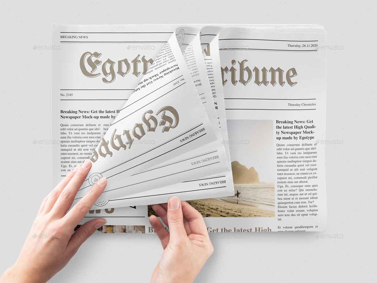 Newspaper in hands mockup